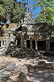 Ta Prohm temple - the badly ruined gopura of the gallery first found entering the site from west